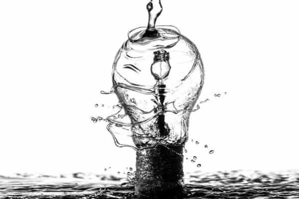 Water pouring onto a lightbulb